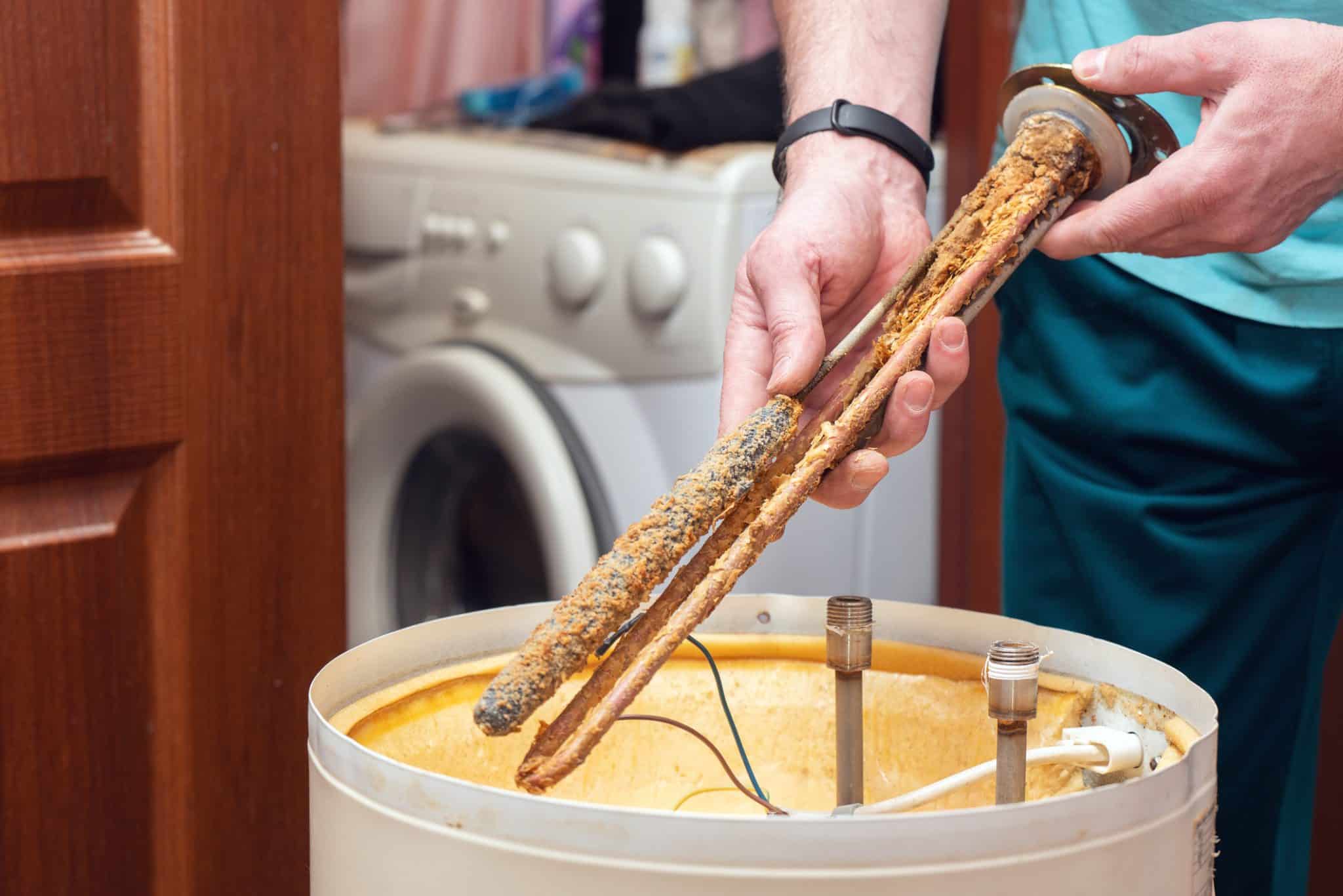 The water heating element of the boiler is covered with sediment and limescale.